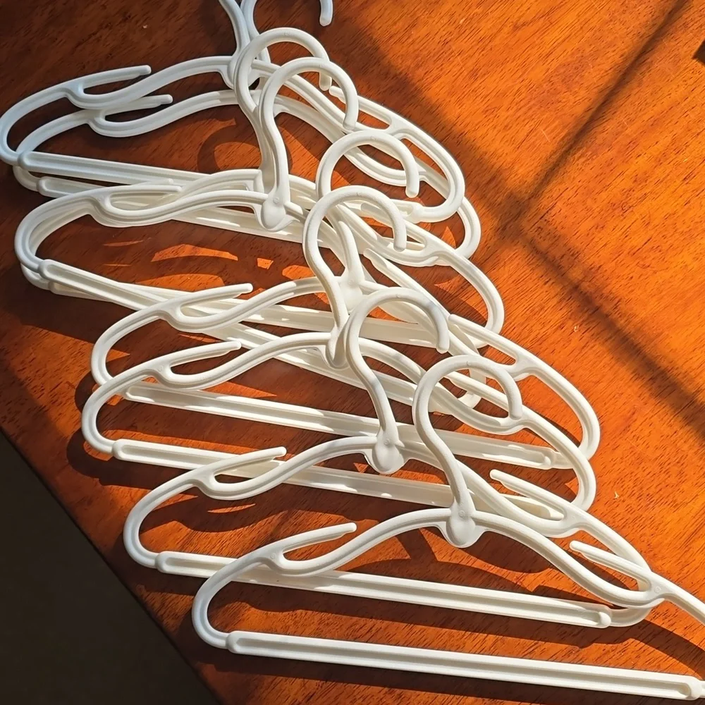 9 Plastic White Baby Hangers -VGUC